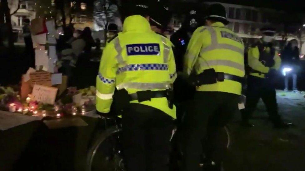 Police at the vigil