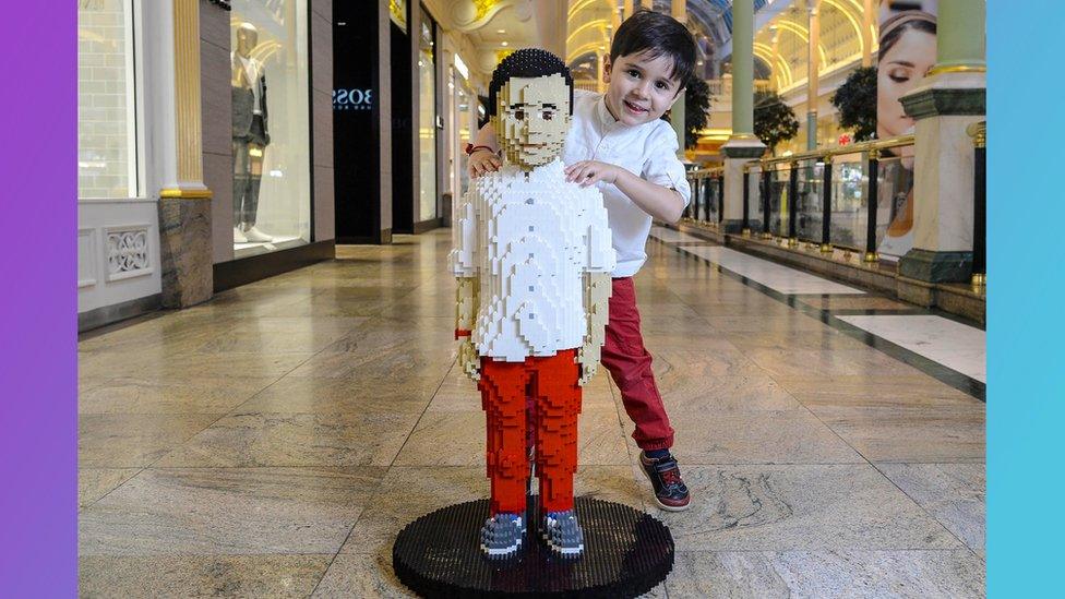 Sunay Urs alongside the Lego model of himself.