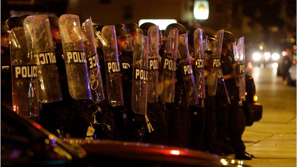 In file photo of Sunday 14 August 2016, police move in on a crowd throwing rocks at police in Milwaukee during a protest following a police shooting that killed Sylville Smith on Saturday.