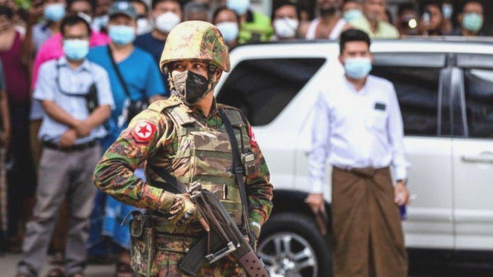 Soldier in crowd in Myanmar