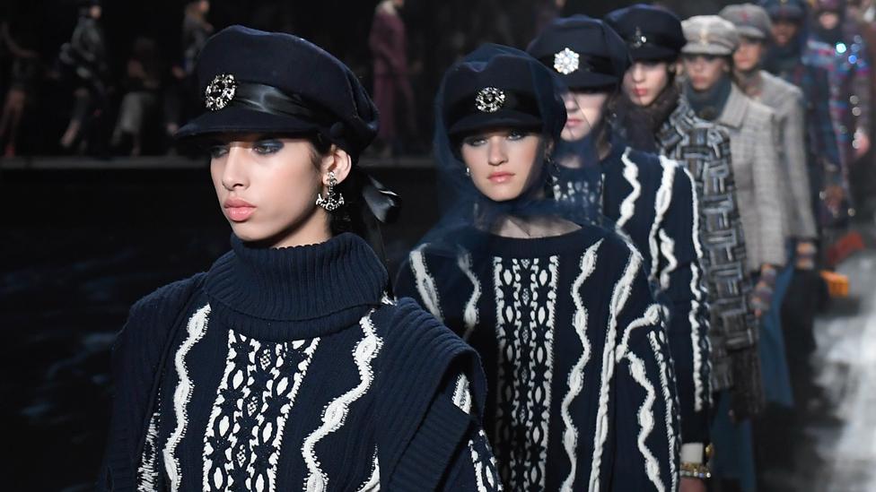 Models walk in a Chanel fashion show in Moscow in 2018