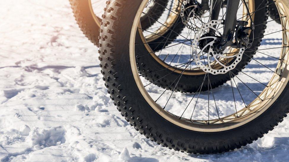 Bicycle wheel on snow