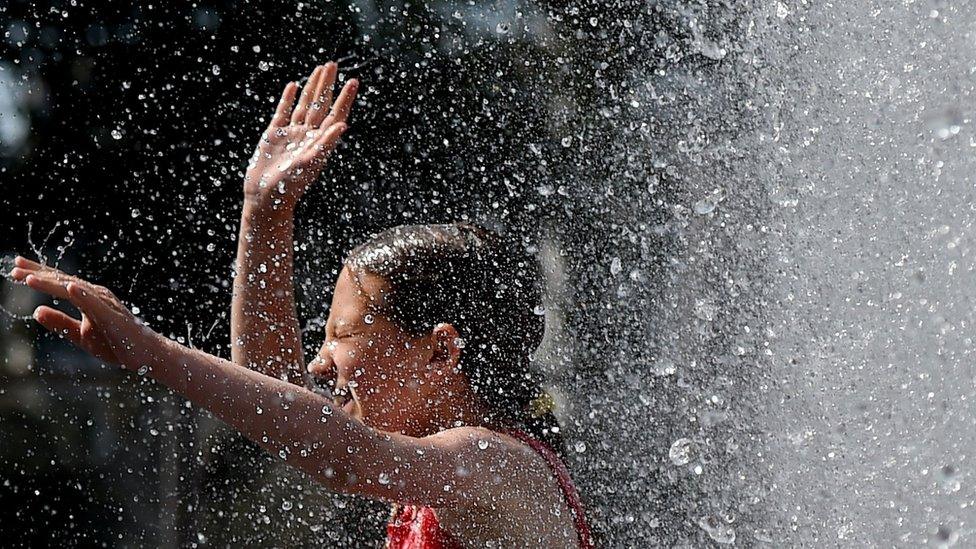 A child in water spray.