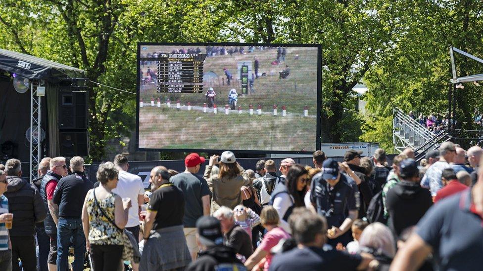 Fans watching coverage of the racing on a big screen