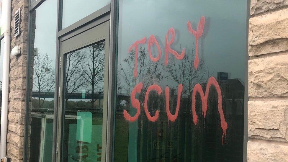 Graffiti on David Morris' office reading: "Tory Scum"