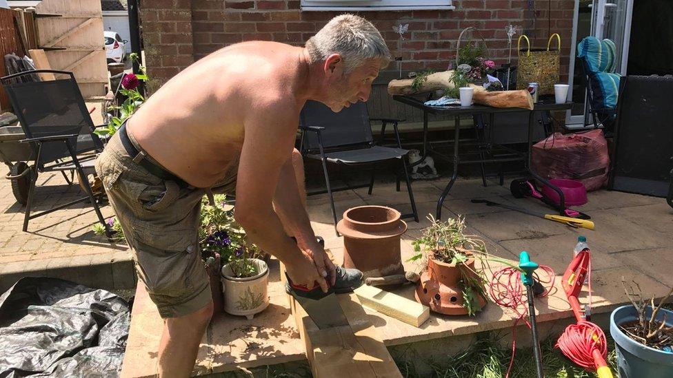 Volunteers working on Darren Black's garden