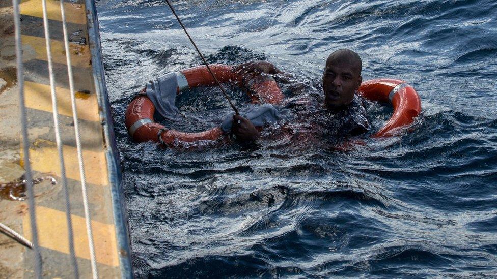 A migrant shown being rescued on January 4, 2019