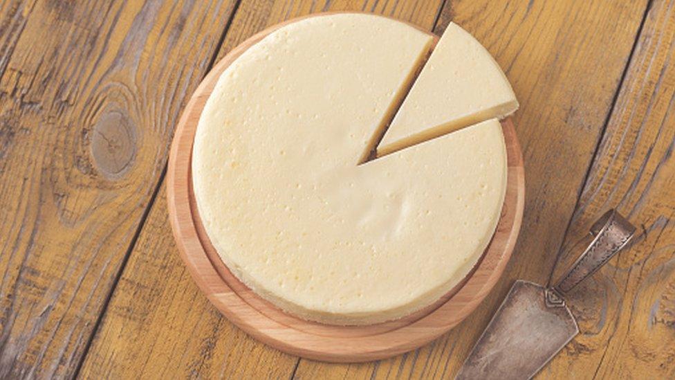 Traditional cheesecake on the wooden table flat lay