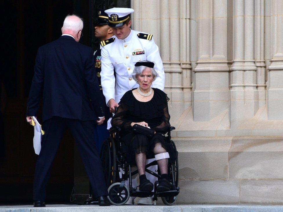 Roberta McCain pictured in a wheelchair outside the Washington National Cathedral