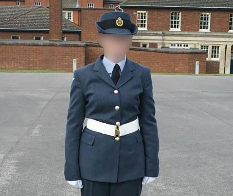 Sam, her face blurred, in uniform