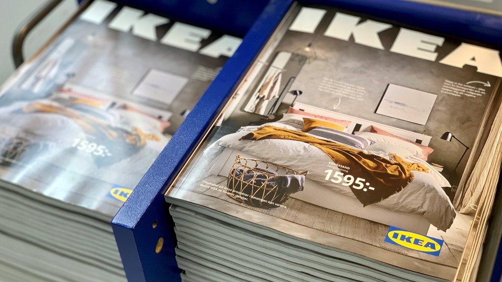 The 2021 catalogues are stacked at an IKEA store on the outskirts of Stockholm