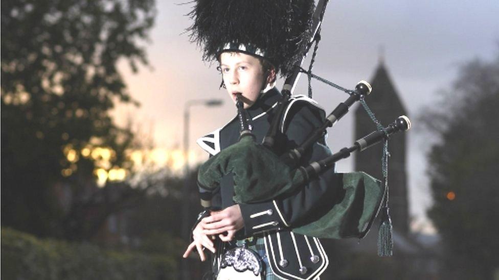 boy playing bagpipes