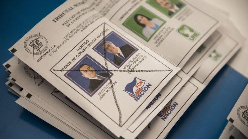 A ballot marked for Jimmy Morales is counted by electoral workers at a polling station during the presidential runoff election in Guatemala City on 25 October, 2015