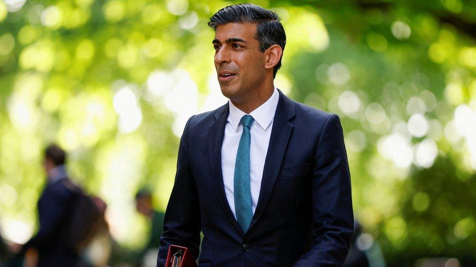 British Chancellor of the Exchequer Rishi Sunak leaves Millbank Studios after a media interview in London