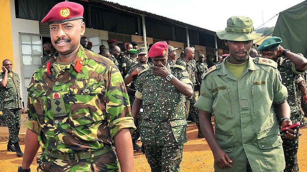 This photo taken on August 27, 2012, shows Brigadier Muhoozi Kainerugaba (L), new commander of the Ugandan Special Forces Command, at the Sera Kasenyi training centre for Special Forces in Kampala on August 16, 2012.