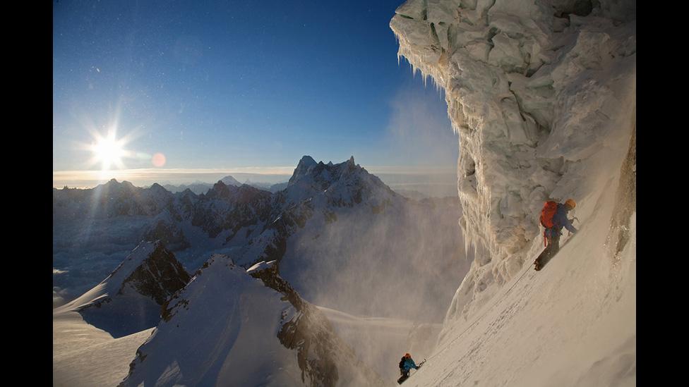Two alpinists on the Triangle du Tacul (4,248m) at sunrise.