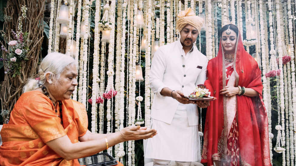 Female priest and Dia Mirza and her husband in wedding clothes