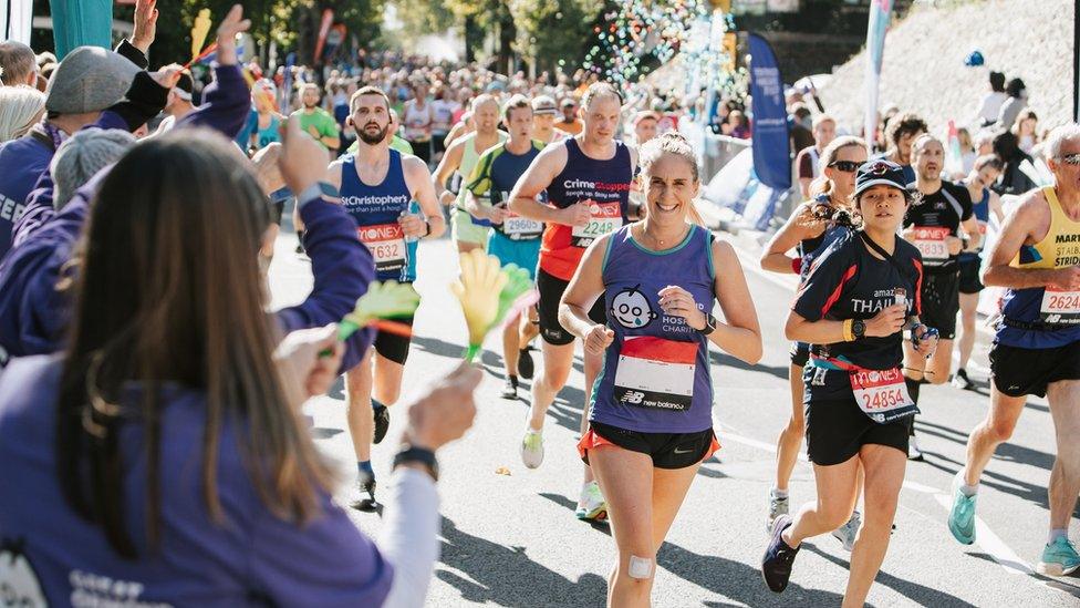 Runners completing the marathon in London