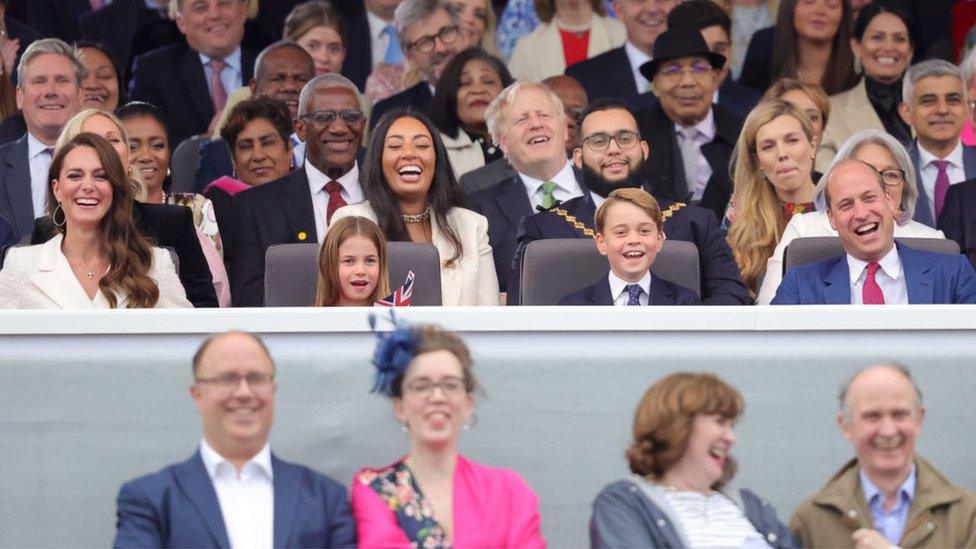 The Cambridge family sit in the royal box