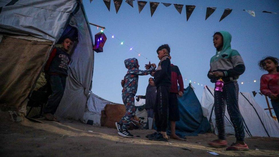 a few Ramadan decorations outside tents in Deir al Balah