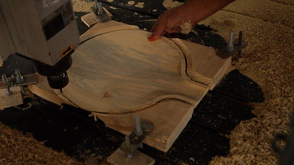 A body of the Sitar being carved out of wood