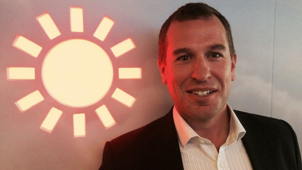 Peter Phillips standing in front of the sun at the BBC Weather Centre