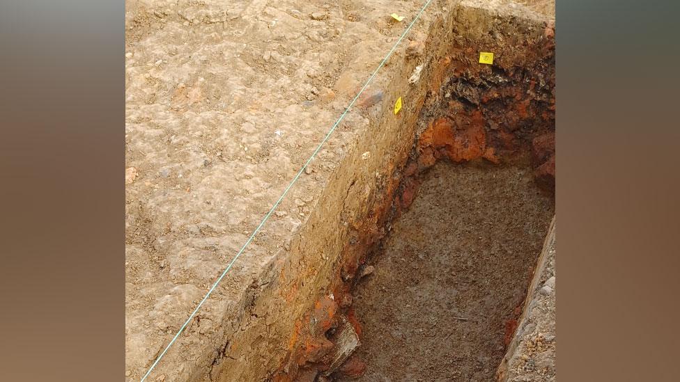 Trench showing remains of Roman kiln, Colchester