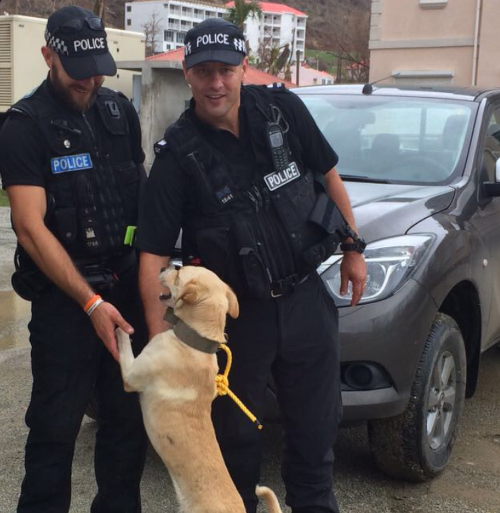 Buddy with PC Harvey, left, and PC French