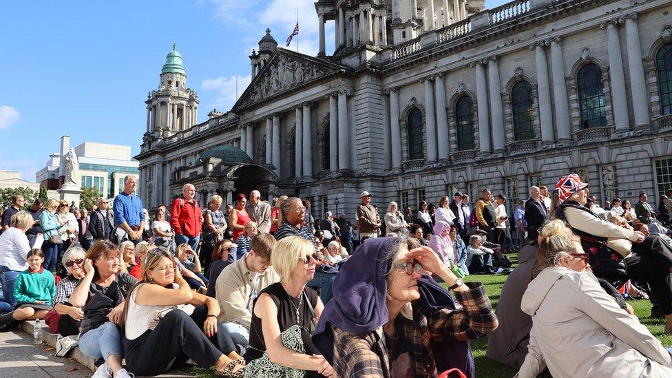 Crowds at city hall watching church service