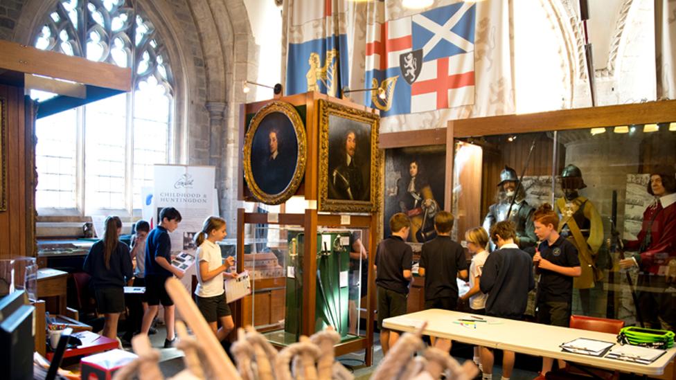 Interior with school children of Cromwell Museum before renovation