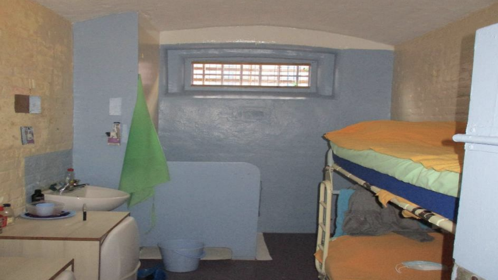 Two person cell at HMP Exeter with bunks and toilet