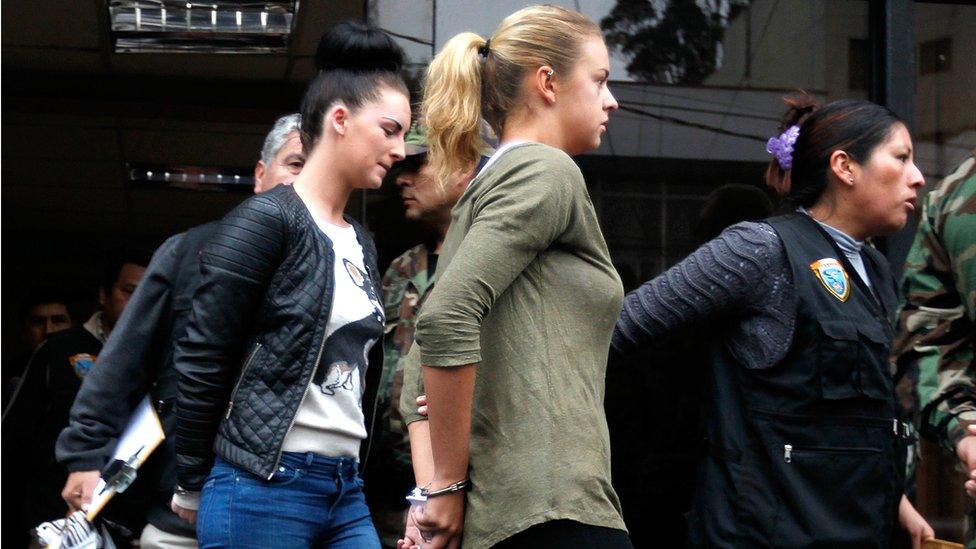 Michaella McCollum and Melissa Reid in handcuffs being taken from a court in Lima, Peru, in 2013