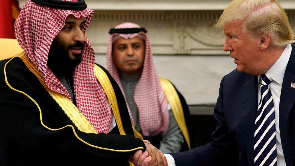 Saudi Crown Prince Mohammed bin Salman shakes hands with US President Donald Trump at the White House on 20 March 2018