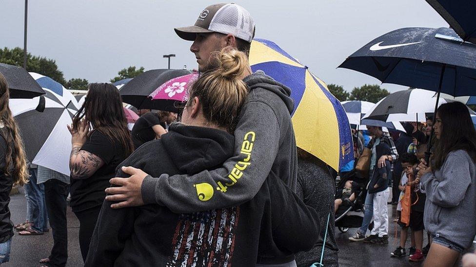 A prayer vigil is held in response to a mass shooting at the Virginia Beach Municipal Center in Virginia Beach, 1 June 2019