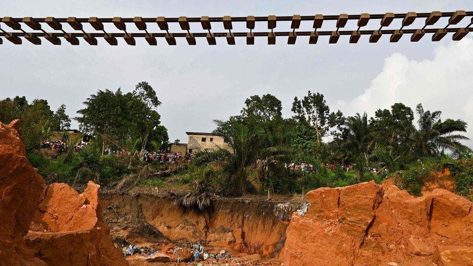 A suspended railway track at the site of a landslide that killed 13 people the day before, in Anyama, near Abidjan - 19 June 2020