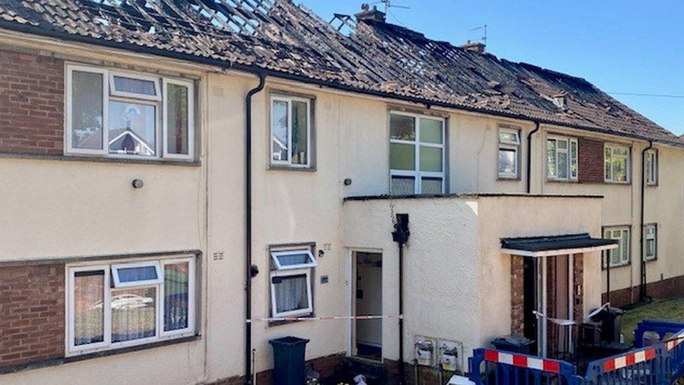 Damaged flats with roofs destroyed