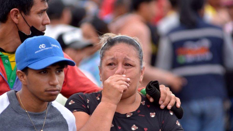 A relative of an inmate reacts outside the Bella Vista prison after a riot, in Santo Domingo de los Tsachilas, Ecuador, on May 9, 2022