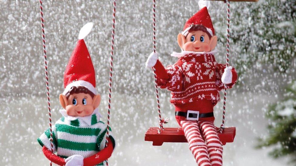 Naughty elves in a snowy scene