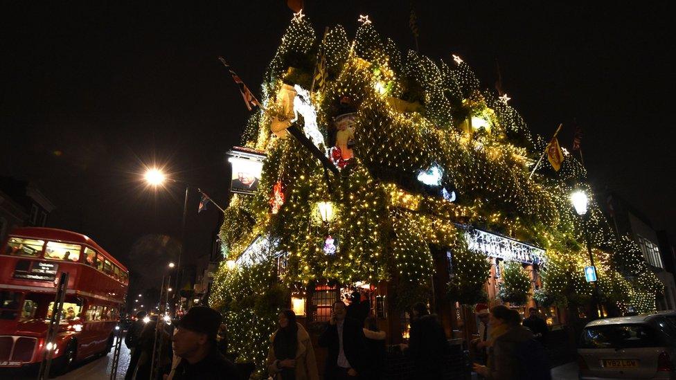 A general view of Christmas decorations outside The Churchill Arms pub