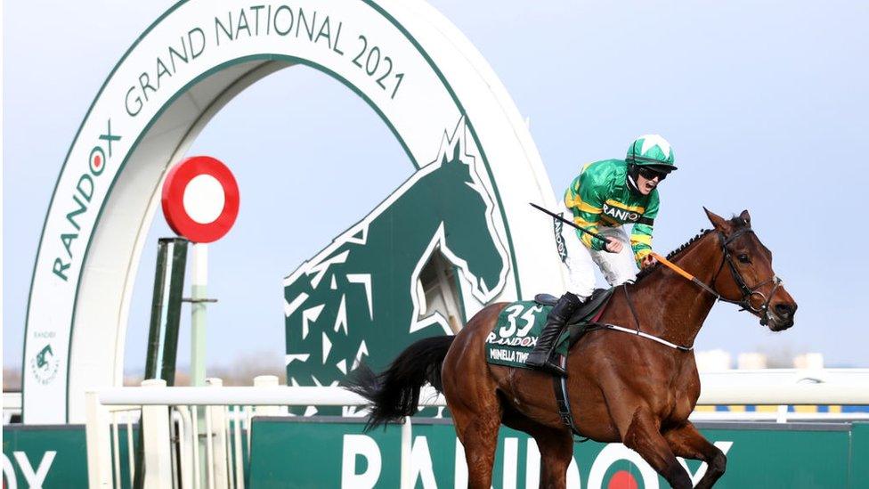 Randox branding behind Grand National rider