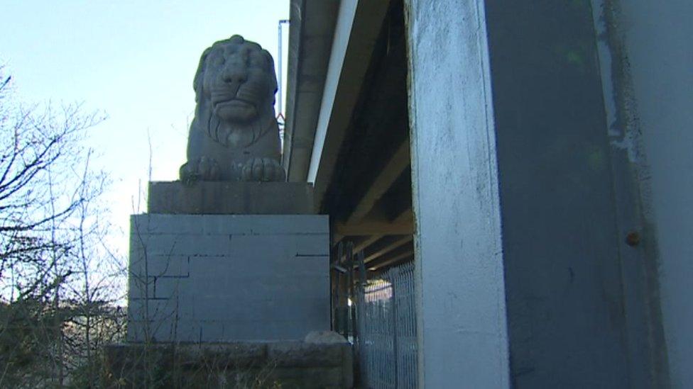 Campaigners say the lions are hidden from view and should be raised up