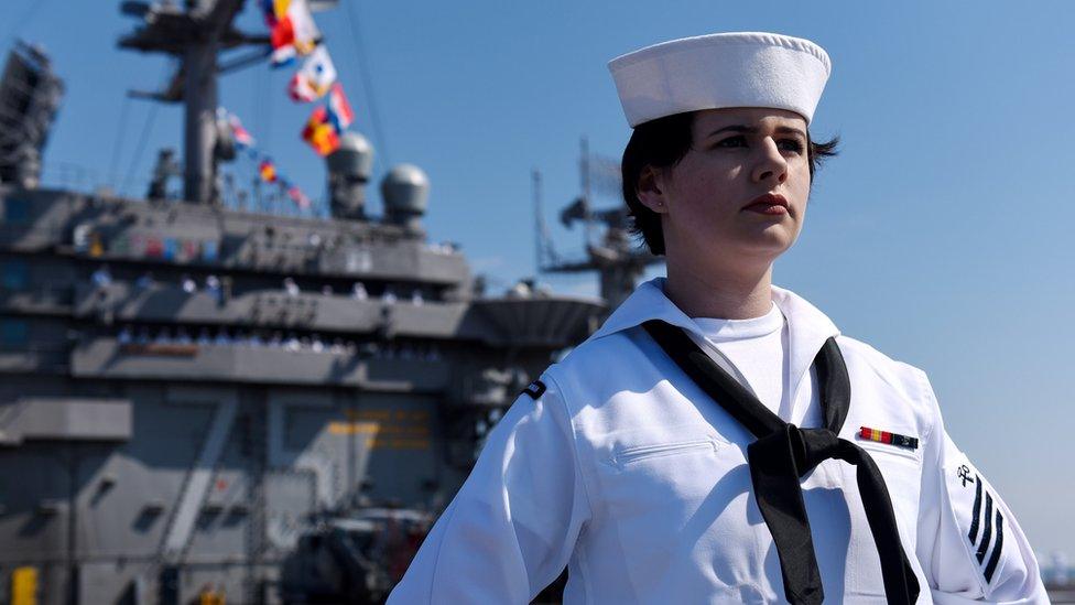 A sailor aboard the US Navy aircraft carrier USS Harry S. Truman during the ship's departure with its strike group towards the Middle East from homeport of Naval Station Norfolk, Virginia, US, 11 April 2018