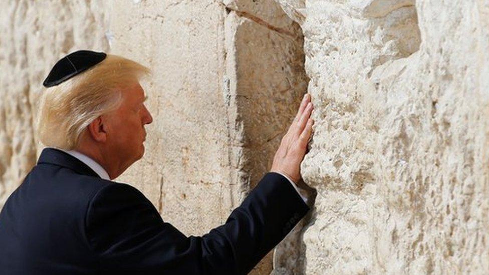 US President Donald Trump touches the Western Wall, Judaism's holiest prayer site, in Jerusalem's Old City