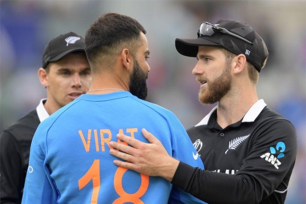 New Zealand"s captain Kane Williamson (R) greets India"s captain Virat Kohli at the end of play during the 2019 Cricket World Cup first semi-final between New Zealand and India at Old Trafford in Manchester, northwest England, on July 10, 2019. -