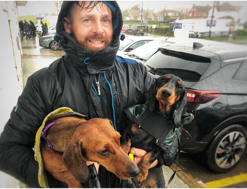 Kes Vadika with his two dogs