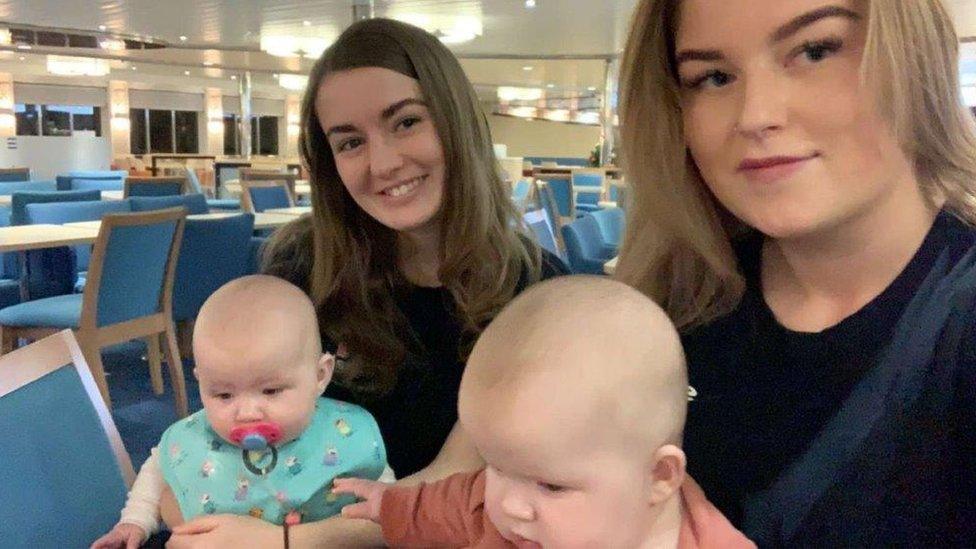 Stena Line crew holding two babies