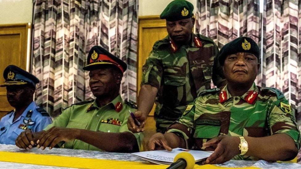 Zimbabwe Army Gen Constantino Chiwenga, commander of the Zimbabwe Defence Forces (R), and Valerio Sibanda, commander of the Zimbabwe National Army address a media conference held at Zimbabwean army headquarters in Harare on Monday