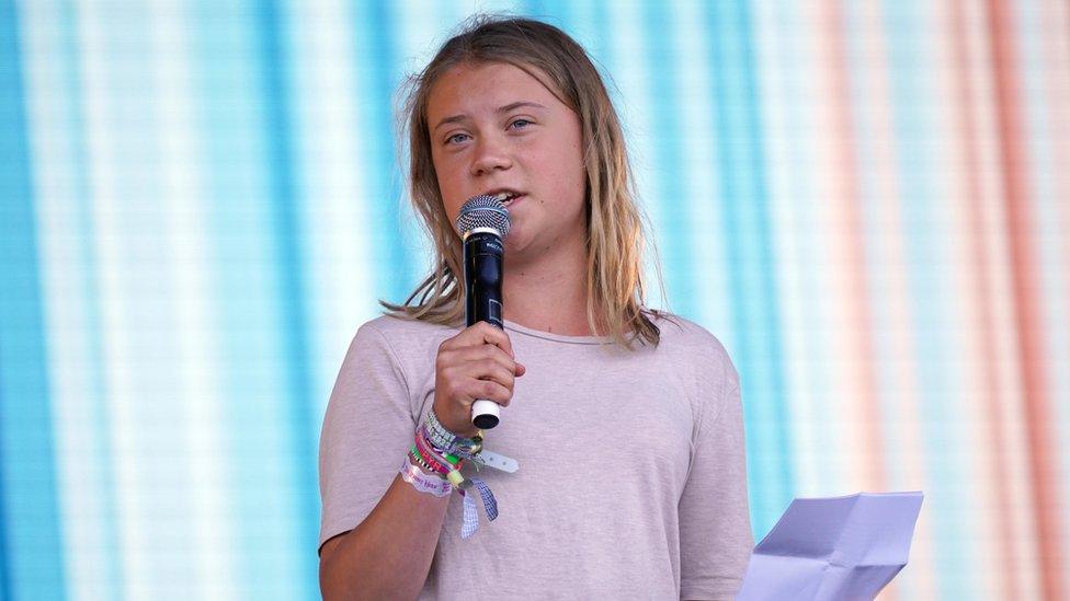 Climate activist Greta Thunberg speaking on the Pyramid Stage during the Glastonbury Festival