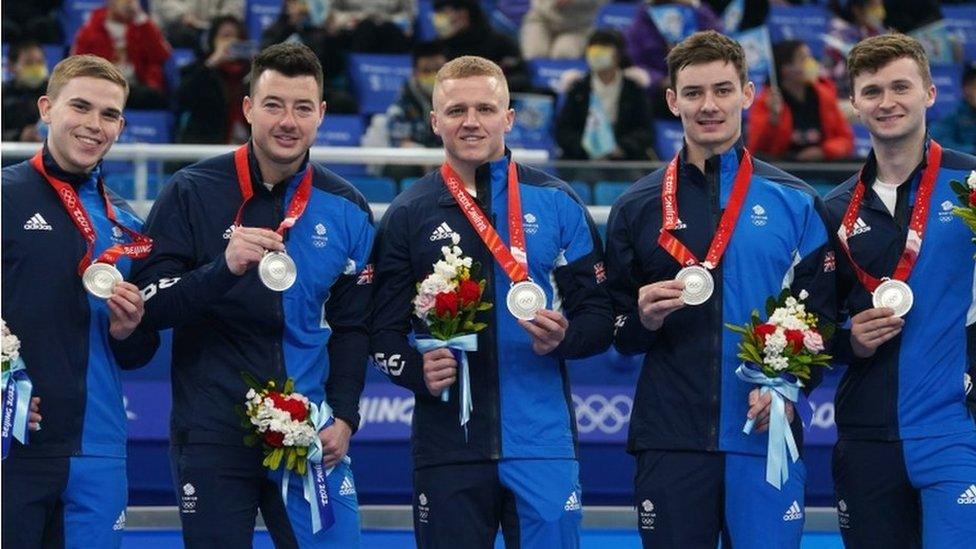 GB men's curling team posing with their silver Olympic medals