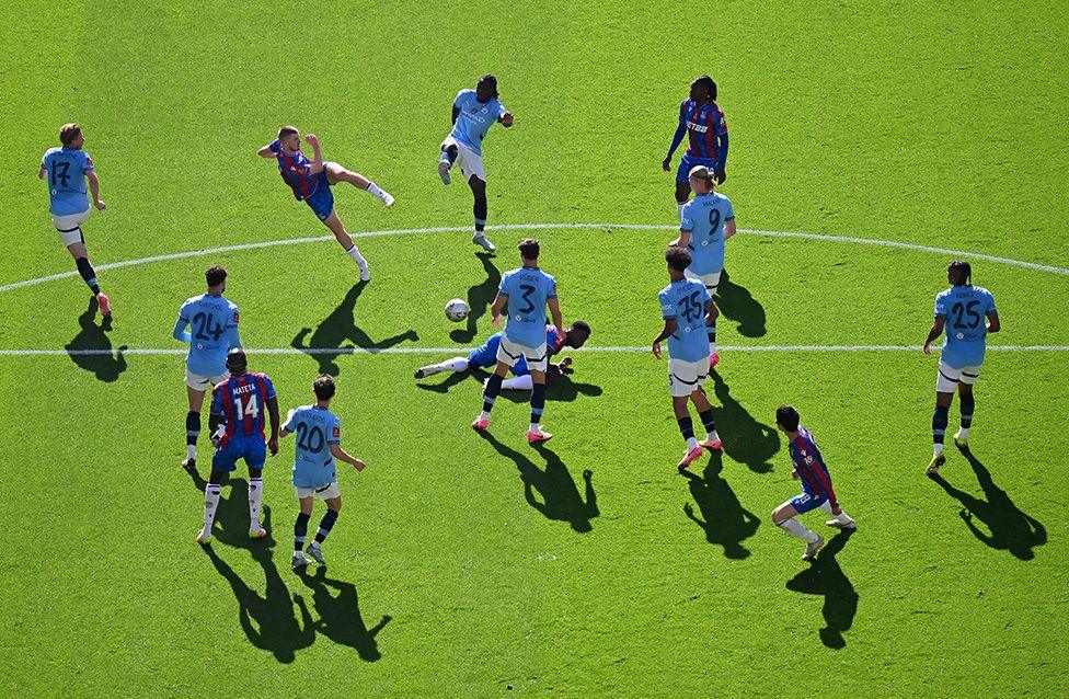 Crystal Palace's Adam Wharton takes a shot at goal through a packed penalty area with sun casting shadows over the Wembley turf, during their 1-0 victory over Manchester City in the FA Cup final. Photo by Dan Mullan